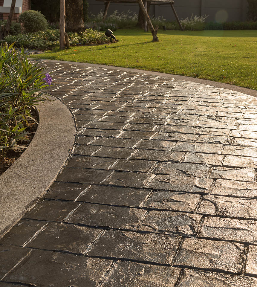 Man Using Measuring Tape in Factory Setting Man Using Measuring Tape in Factory Setting